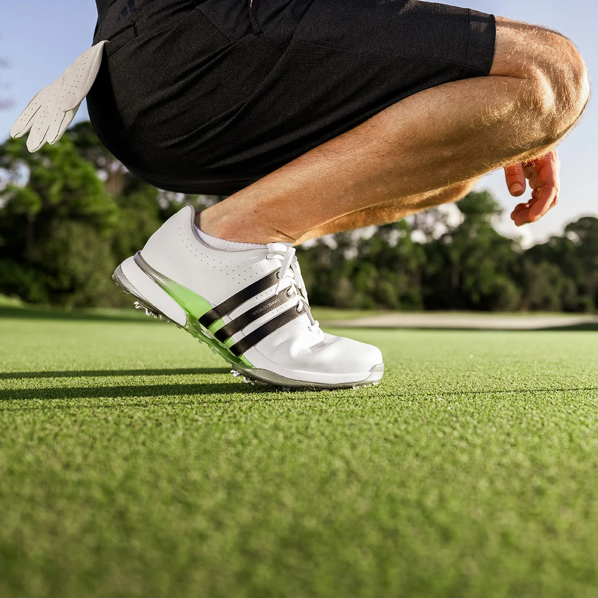 adidas Tour360 24 Boost Golf Shoes Lifestyle Image Squatting